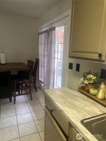 a room with a table and chairs in it