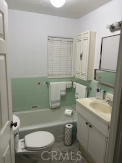 5335 East Avenue I Lancaster, CA 93535 - Photo 13 of 16 a bathroom with a granite countertop toilet sink and mirror