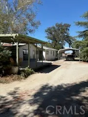 a view of residential houses with snow on the road