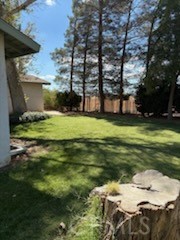 5335 East Avenue I Lancaster, CA 93535 - Photo 4 of 16 a backyard of a house with a yard and outdoor seating
