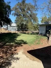 a view of a backyard of the house