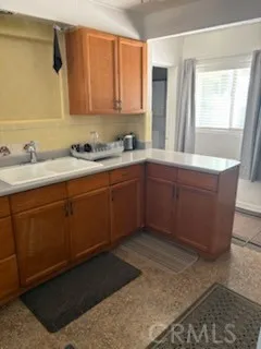 a bath room with sink and window