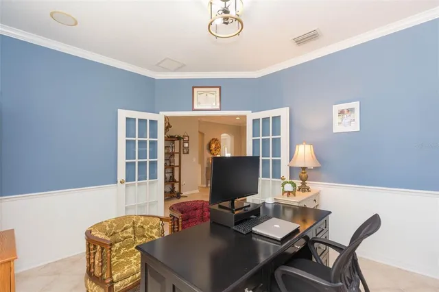 a kitchen with granite countertop a sink stainless steel appliances and white cabinets