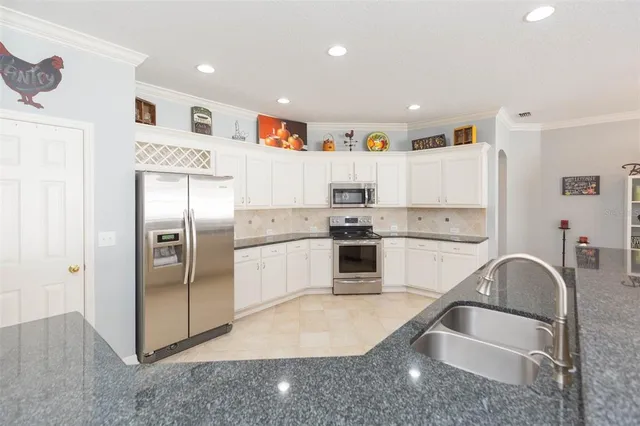 a view of a dining room with furniture and a potted plant