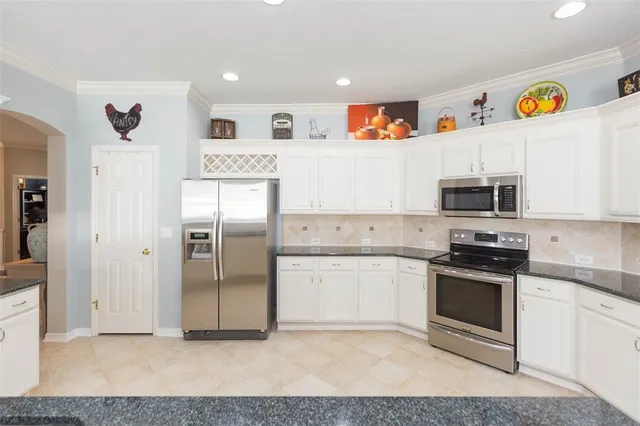 a view of a dining room with furniture and a window