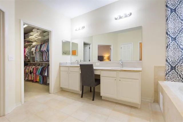 a bedroom with a baby bed baby crib and a dresser