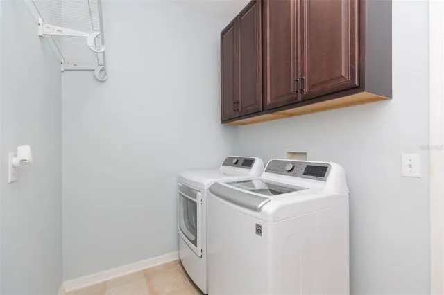 an aerial view of a house with a yard and lake view