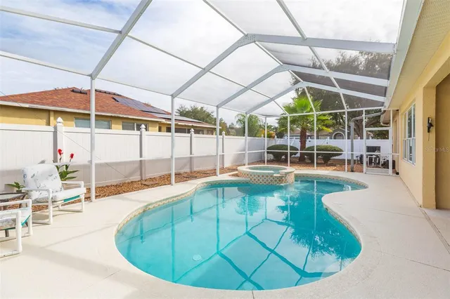 a view of a swimming pool with a patio