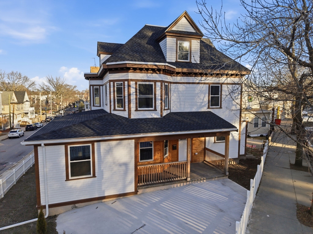 a front view of a house with parking space
