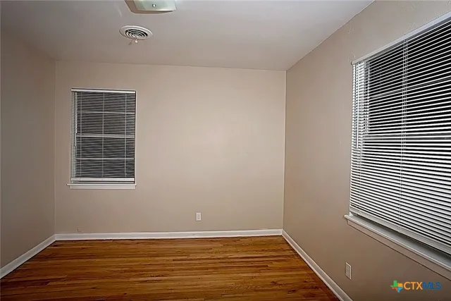 a bathroom with a toilet and a bathtub