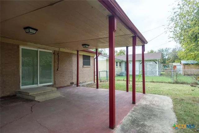 a view of a backyard with garden