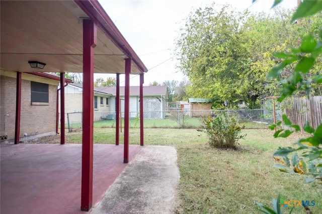 a view of a backyard with in the deck