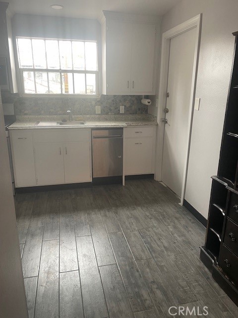 400 North Gibbs Street, Unit 215 WEST SIDE Pomona, CA 91767 - Photo 4 of 10 a view of a kitchen with wooden floor and electronic appliances