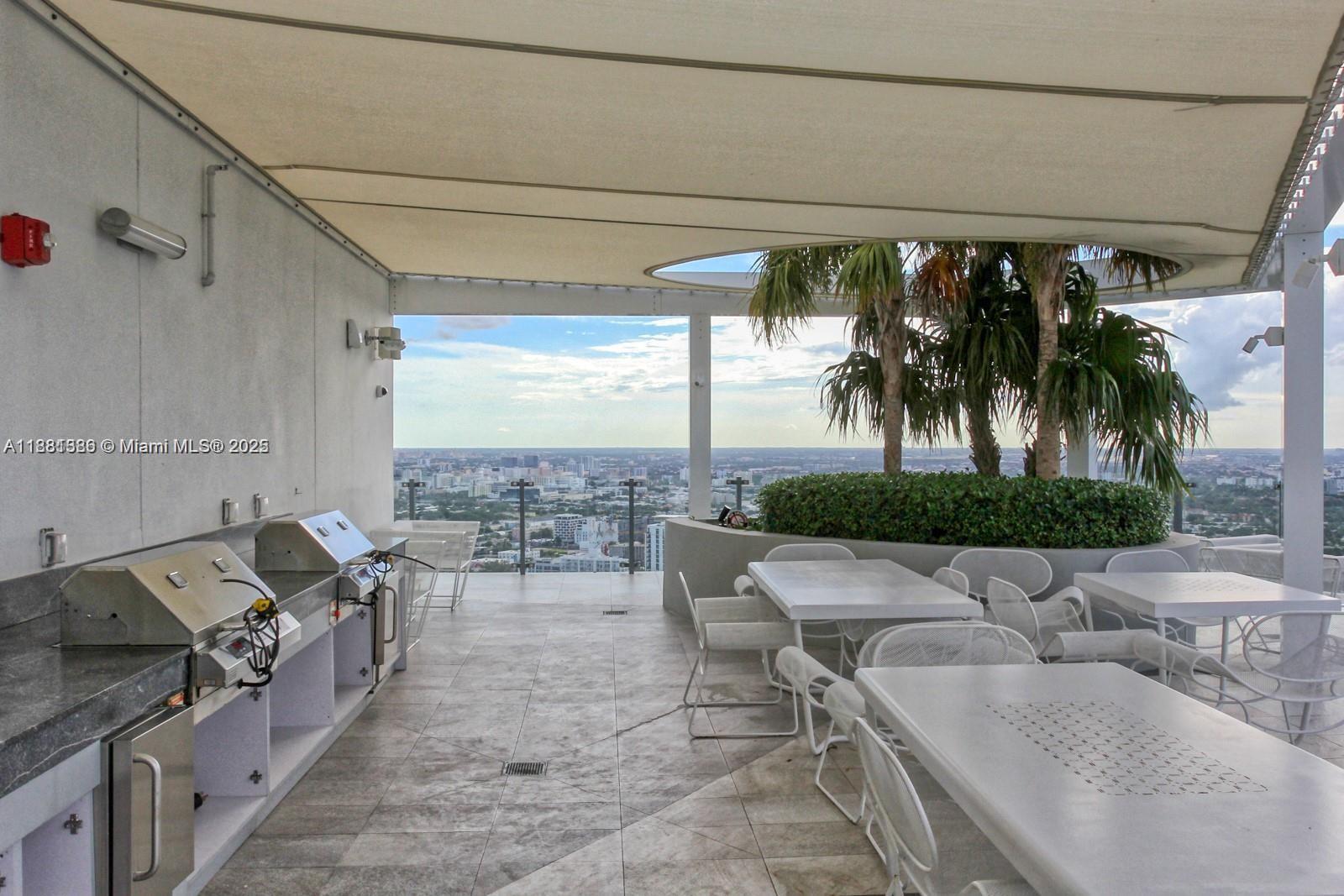 501 Northeast 31st Street, Unit 3906 Miami, FL 33137 - Photo 21 of 32 a living room with furniture and a potted plant