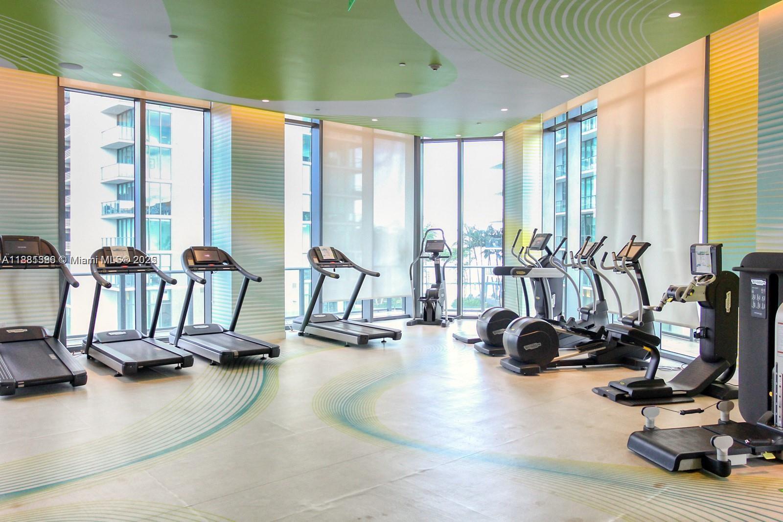 501 Northeast 31st Street, Unit 3906 Miami, FL 33137 - Photo 22 of 32 a view of a room with gym equipment