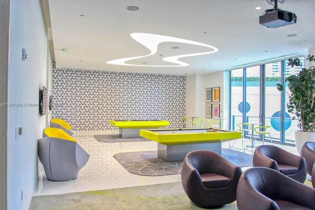 a view of swimming pool with seating area