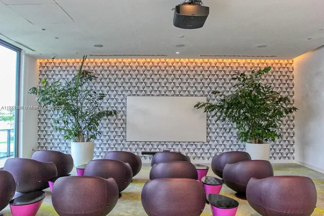 a bathroom with a tub and window