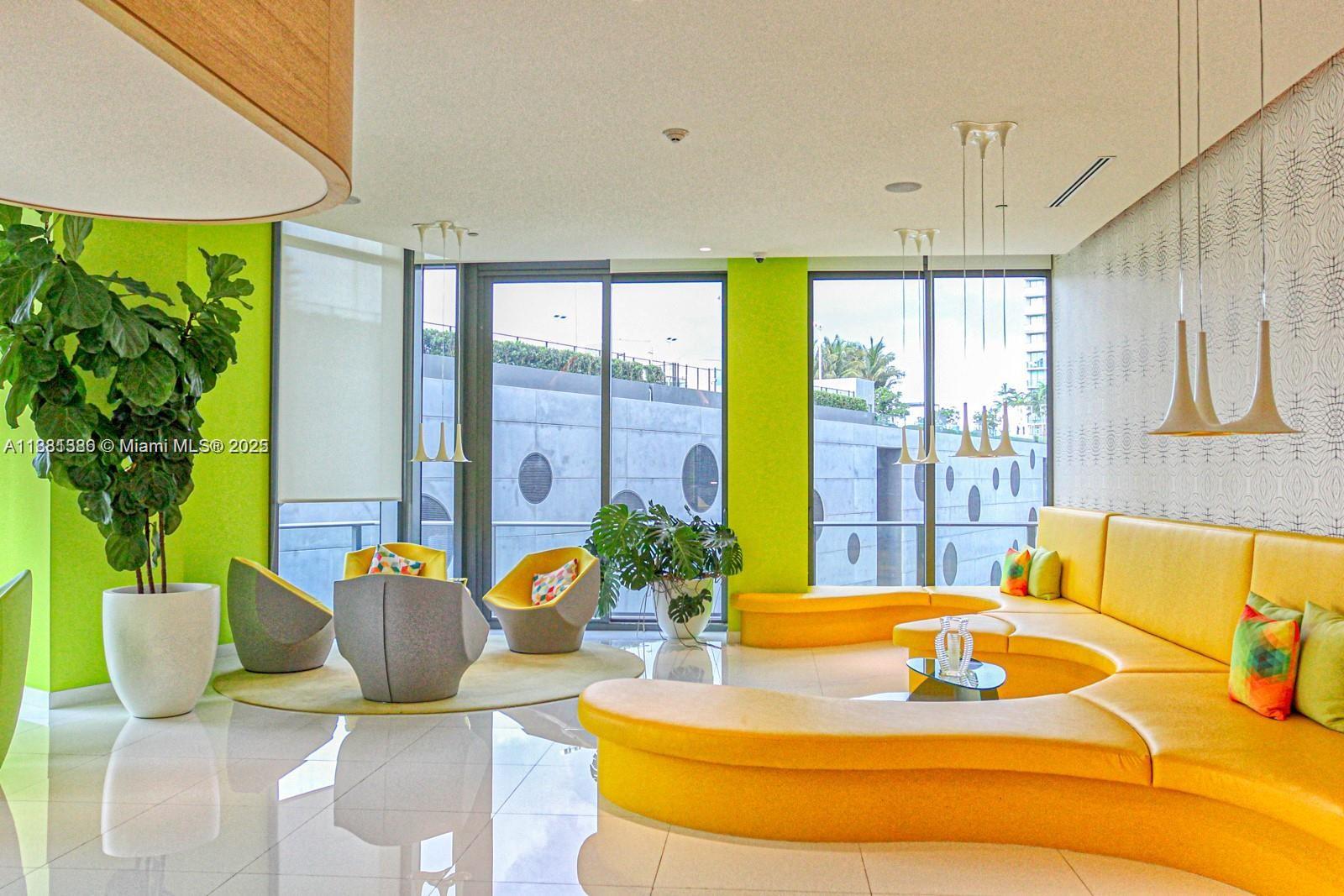 501 Northeast 31st Street, Unit 3906 Miami, FL 33137 - Photo 30 of 32 a living room with patio furniture and a potted plant