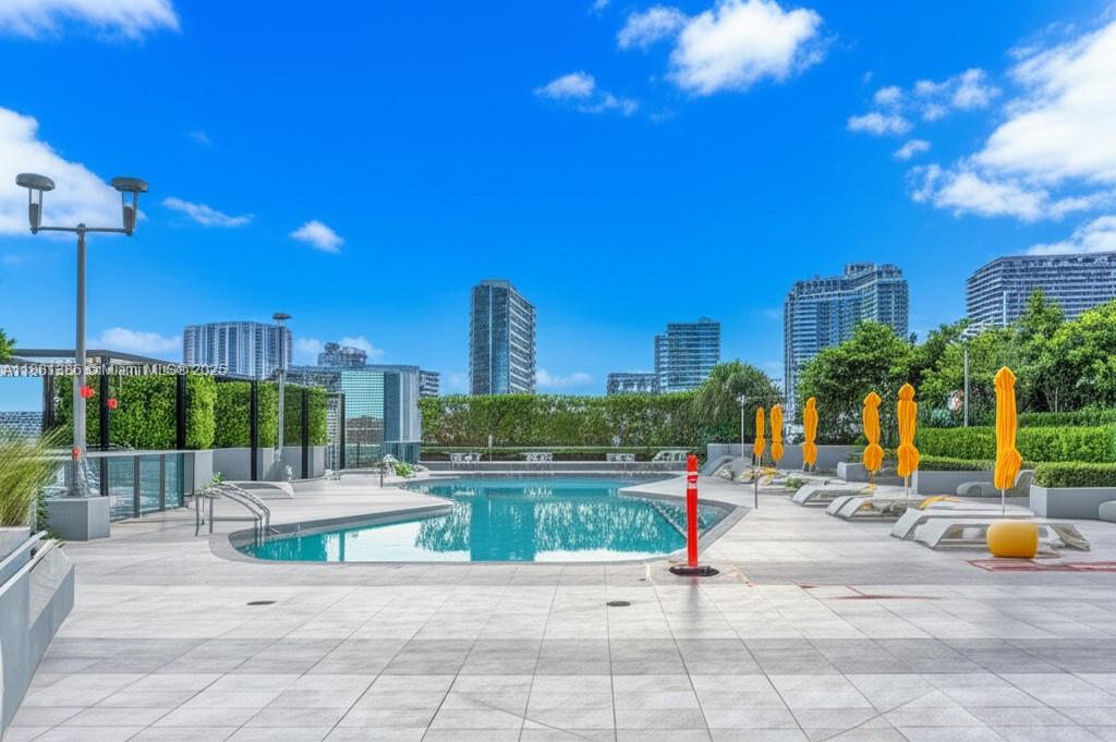 501 Northeast 31st Street, Unit 3906 Miami, FL 33137 - Photo 32 of 32 a view of a patio with a table and chairs