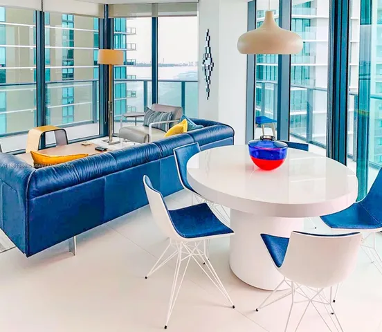 a kitchen with a table and chairs