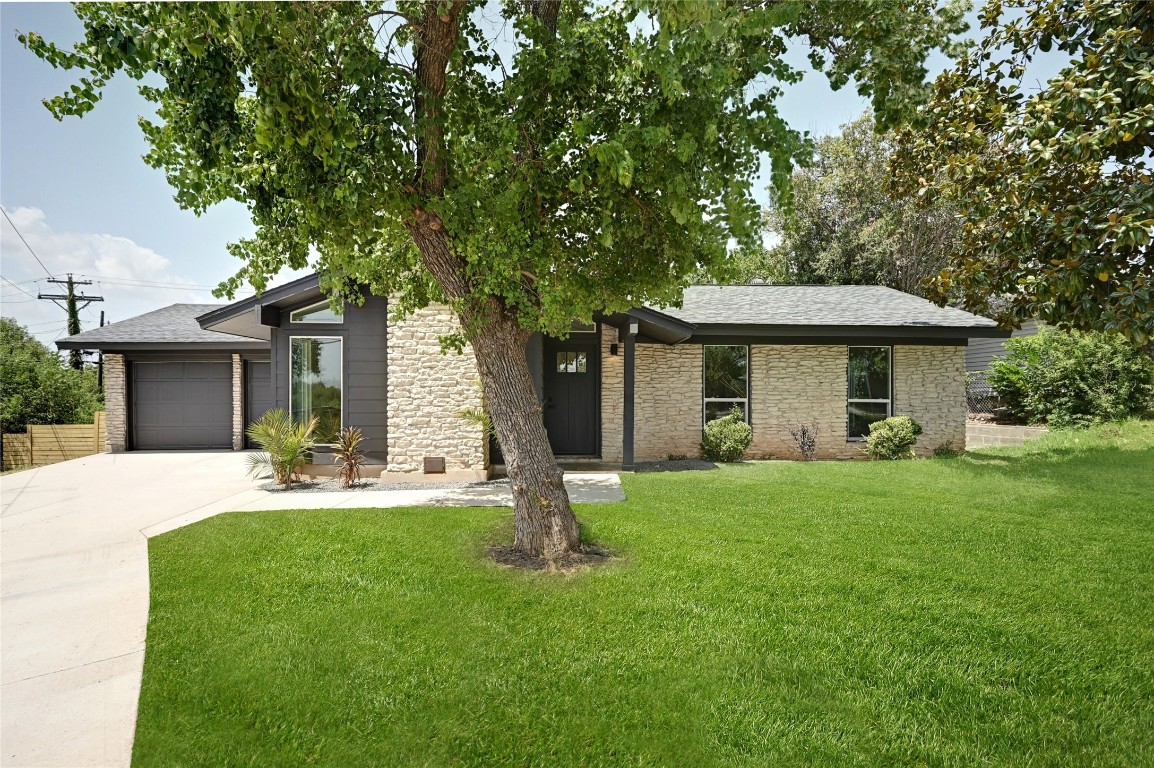 a backyard of a house with seating space