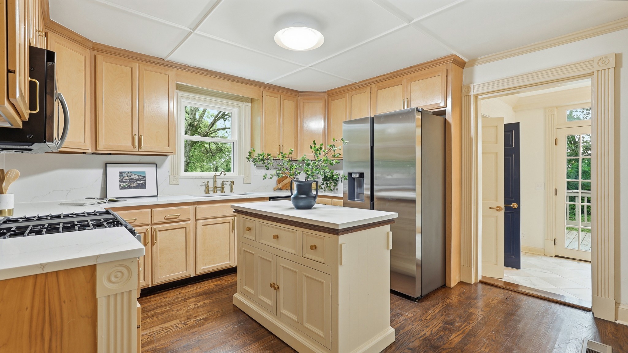 229 Franklin Limestone Road Nashville, TN 37217 - Photo 14 of 41 a kitchen with kitchen island granite countertop a sink cabinets stainless steel appliances and a large window