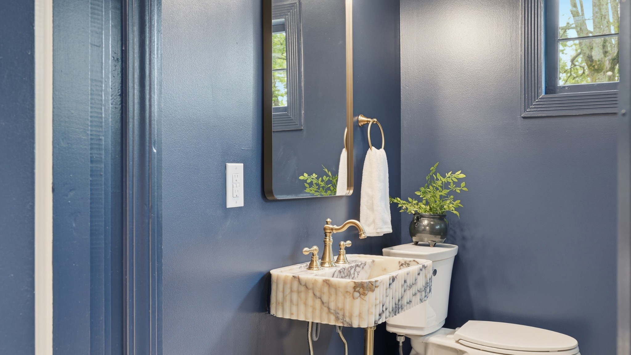 229 Franklin Limestone Road Nashville, TN 37217 - Photo 20 of 41 a bathroom with a toilet sink and mirror
