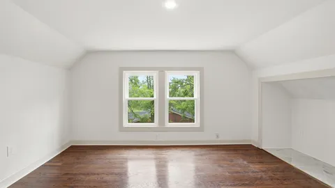 an empty room with wooden floor
