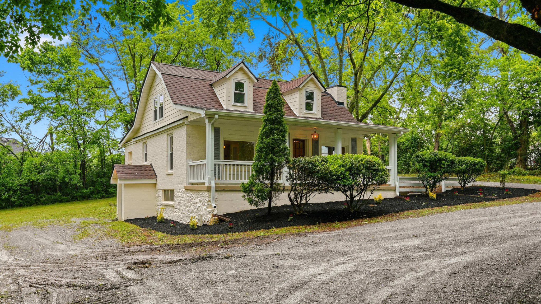 229 Franklin Limestone Road Nashville, TN 37217 - Photo 35 of 41 a view of a white house with a yard and plants