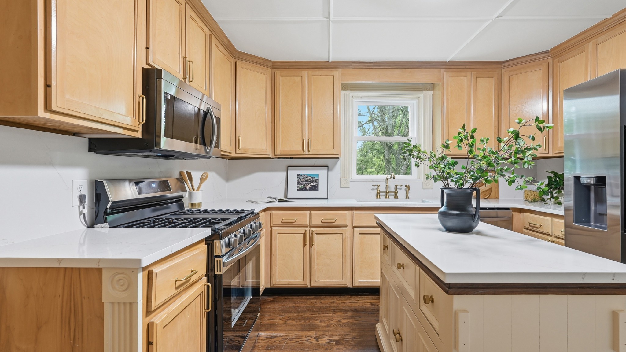 229 Franklin Limestone Road Nashville, TN 37217 - Photo 6 of 41 a kitchen with stainless steel appliances granite countertop a sink a stove a refrigerator cabinets and a window