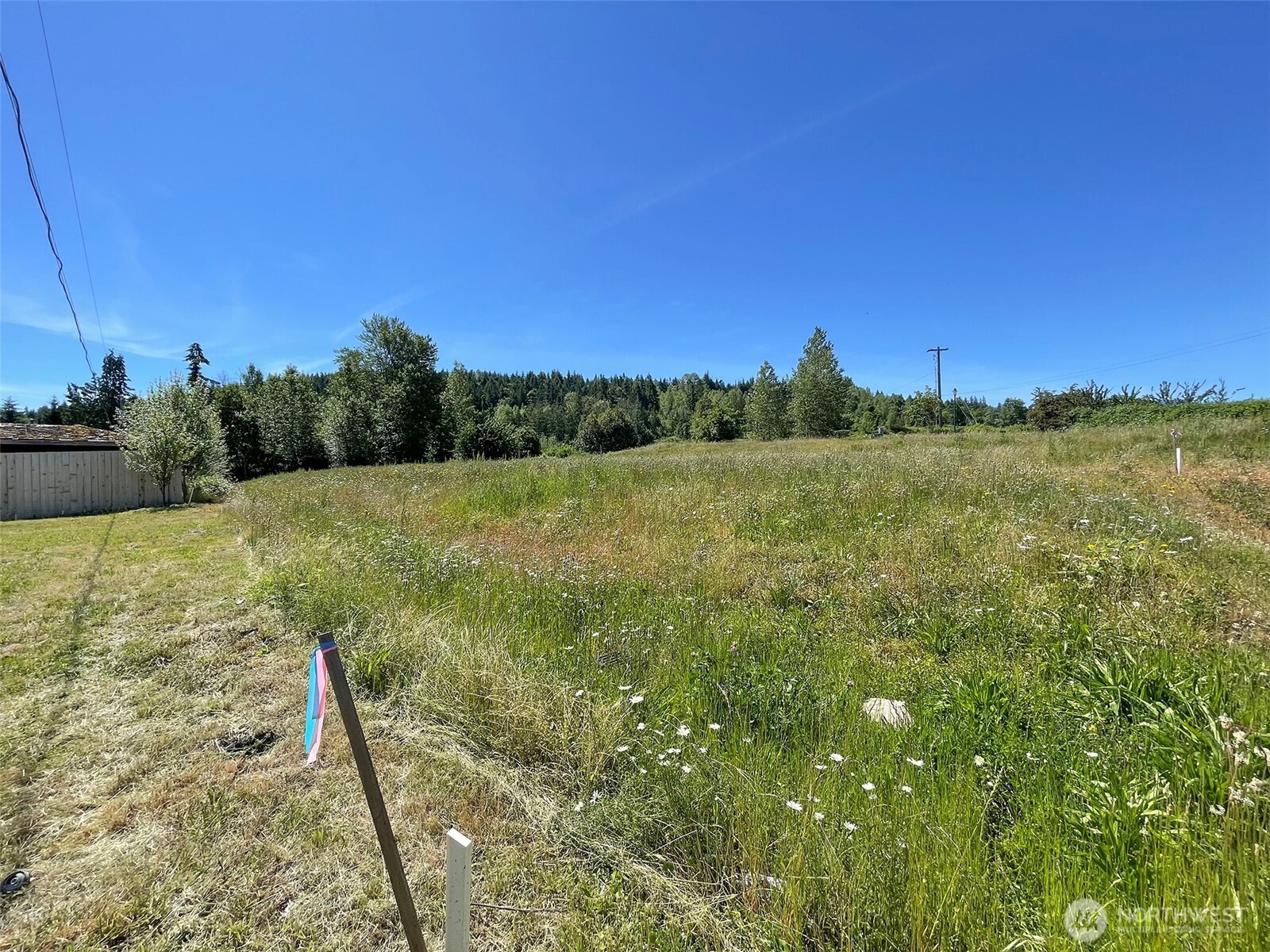 852 South Still Road Sequim, WA 98382 - Photo 11 of 16 a view of a field with an ocean
