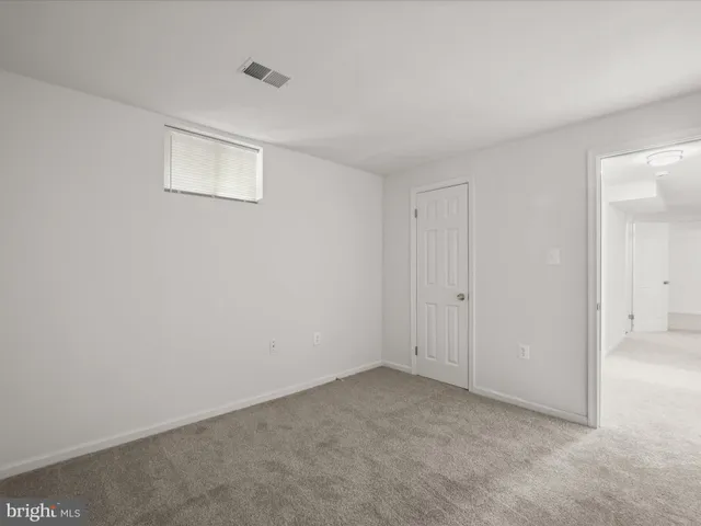 a bathroom with a sink toilet and a mirror
