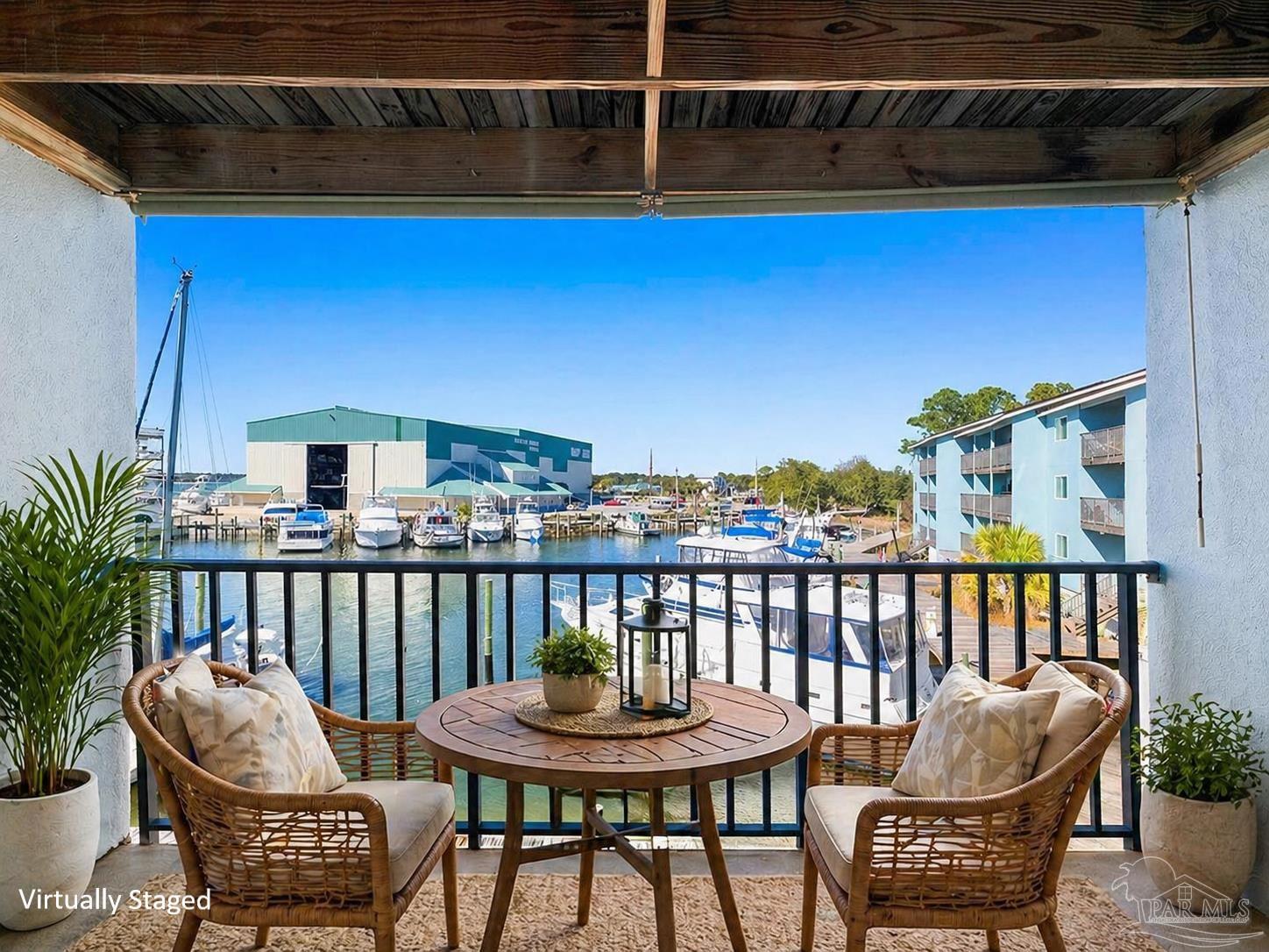 14100 River Road, Unit 228B Pensacola, FL 32507 - Photo 1 of 41 a view of a chair and table in the balcony