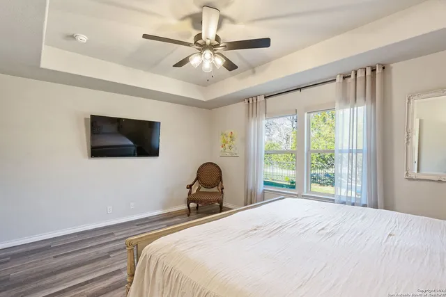 a bedroom with a bed and a chair