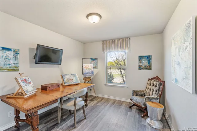 a workspace with furniture and wooden floor
