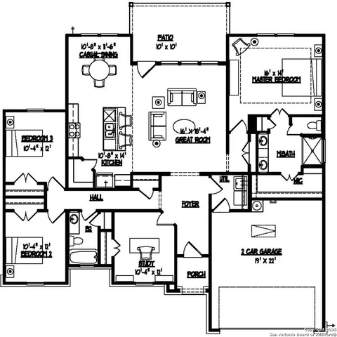 a view of a house with many windows next to a yard