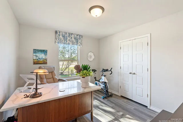 a view of a house with backyard porch and sitting area