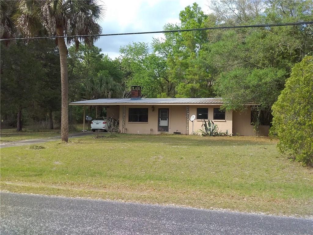18737 Southwest 31st Street Dunnellon, FL 34432 - Photo 1 of 1 a view of a house with backyard
