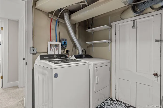 a view of storage and utility room with washer and dryer