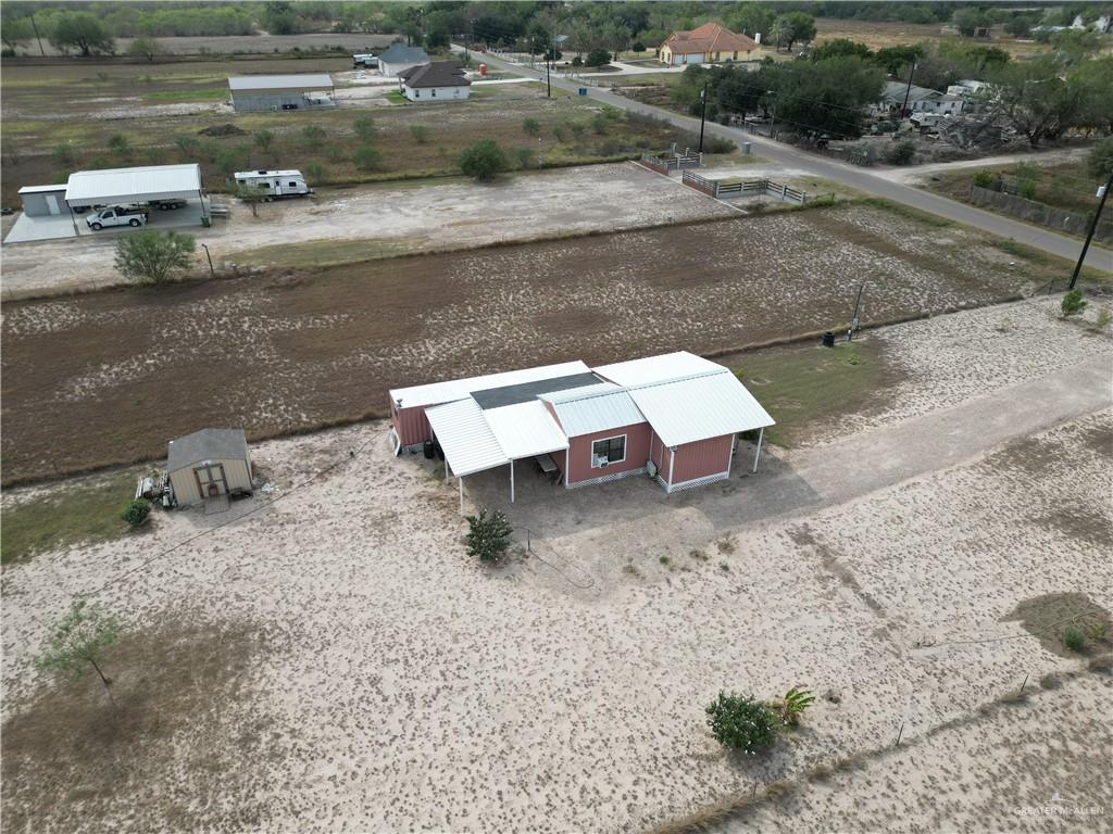 189 Midway Road Rio Grande City, TX 78582 - Photo 18 of 20 Red-sided structure with a white metal roof
