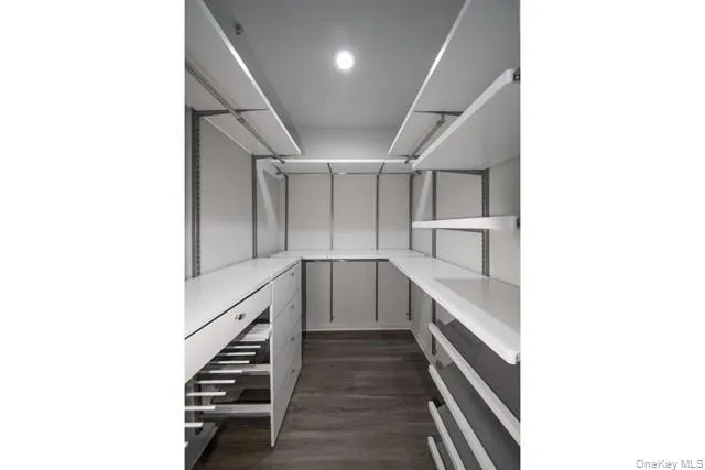 a kitchen with cabinets and white appliances