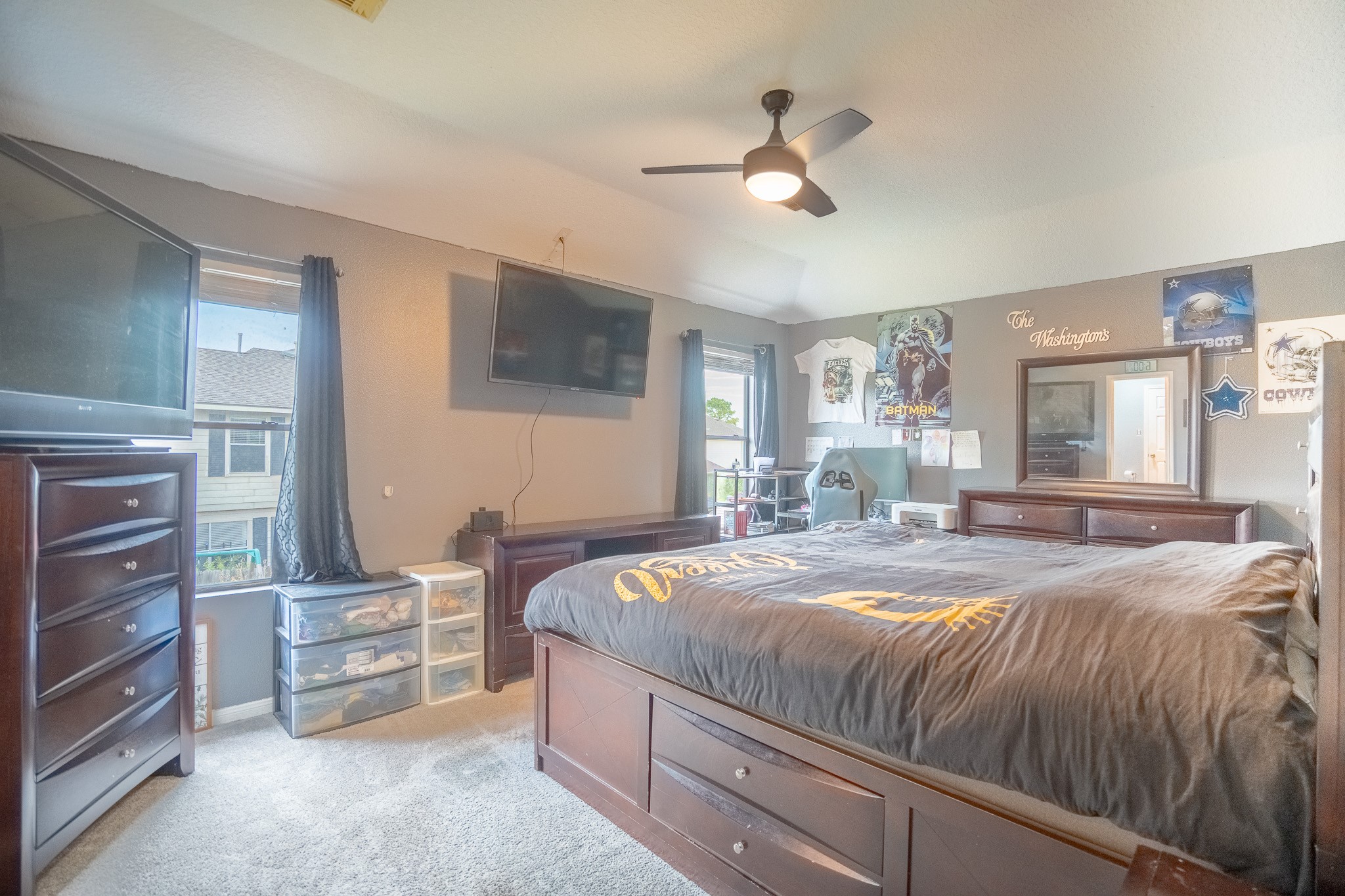 2322 Hadden Hollow Drive Houston, TX 77067 - Photo 15 of 28 a bedroom with a bed and a flat tv screen on dresser