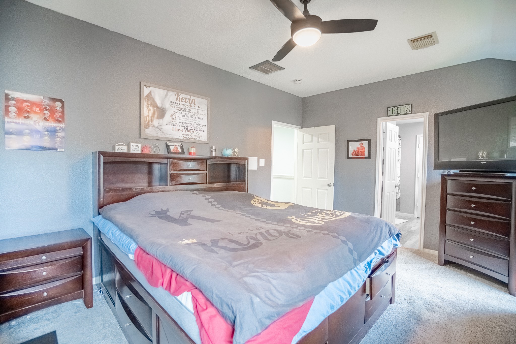 2322 Hadden Hollow Drive Houston, TX 77067 - Photo 16 of 28 a bedroom with a bed and a dresser