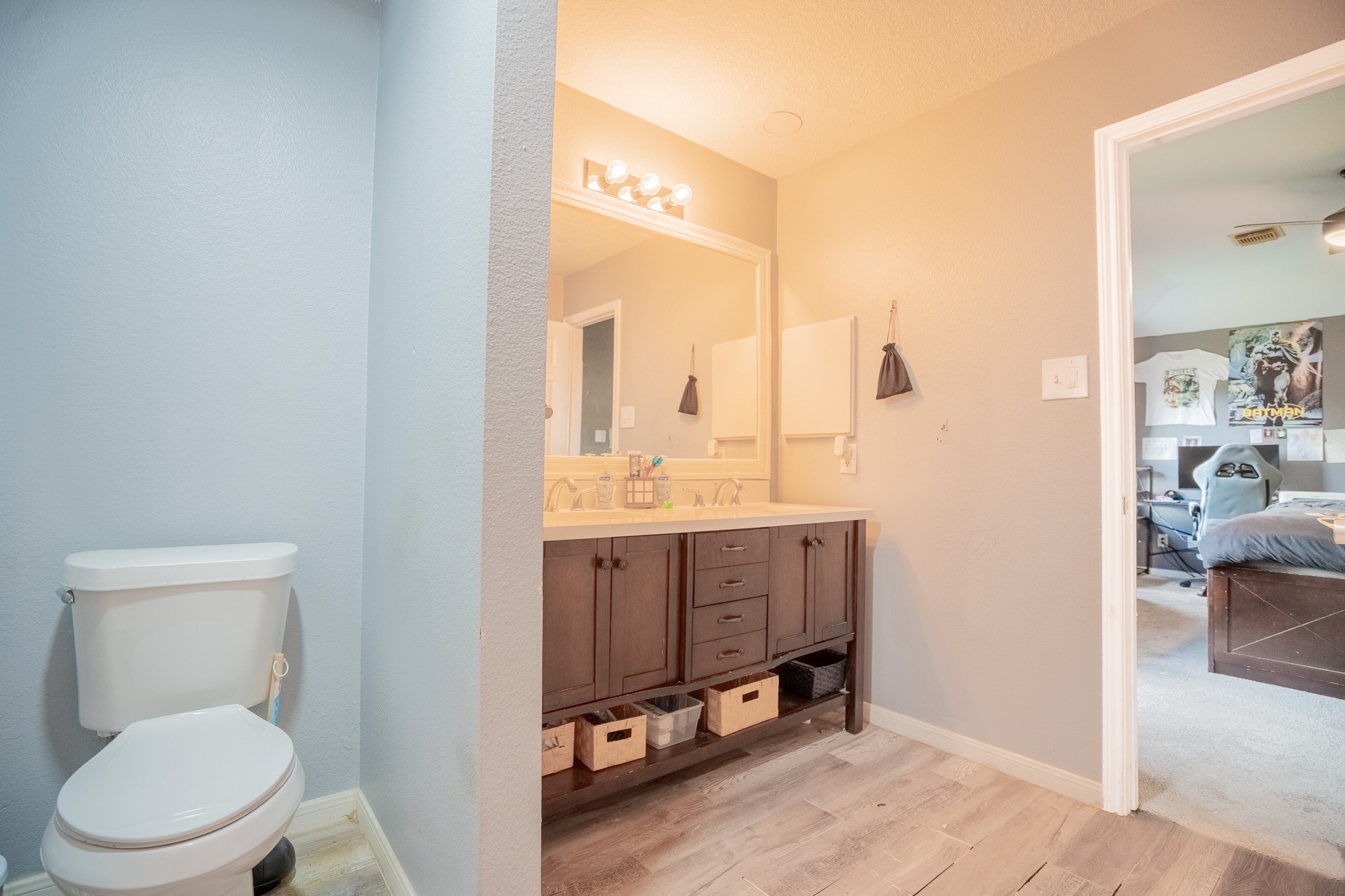 2322 Hadden Hollow Drive Houston, TX 77067 - Photo 18 of 28 a bathroom with a toilet a sink and a mirror