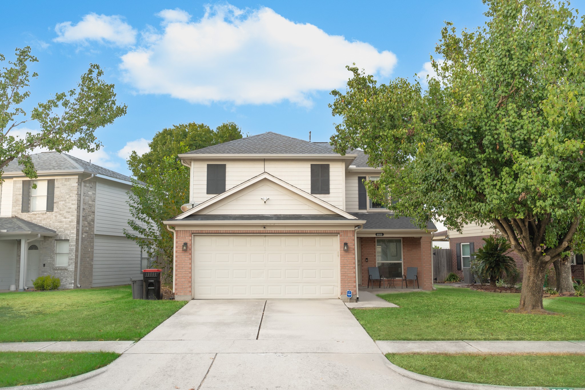 2322 Hadden Hollow Drive Houston, TX 77067 - Photo 2 of 28 a front view of a house with a garden