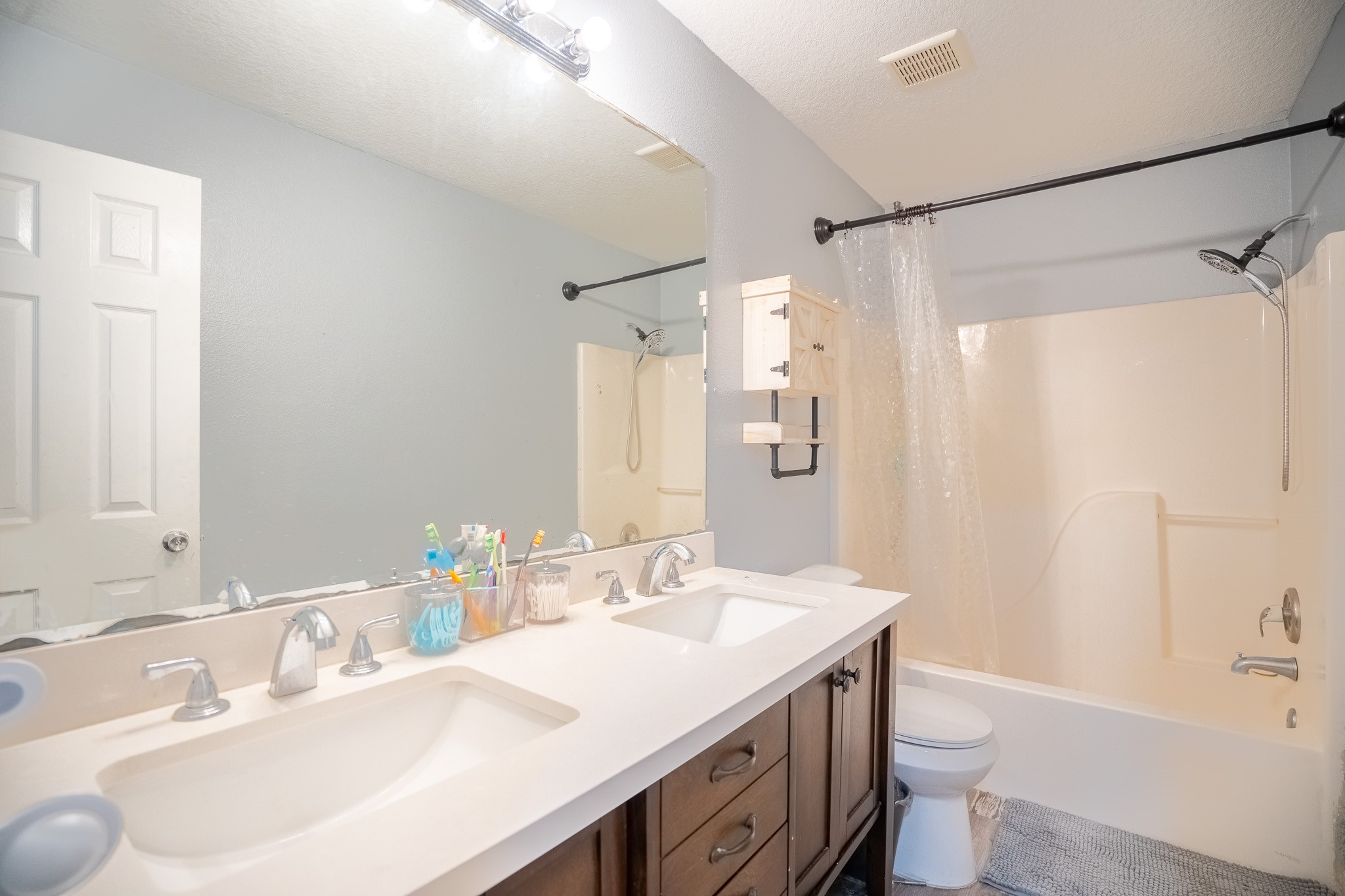 2322 Hadden Hollow Drive Houston, TX 77067 - Photo 24 of 28 a bathroom with a granite countertop sink toilet and shower