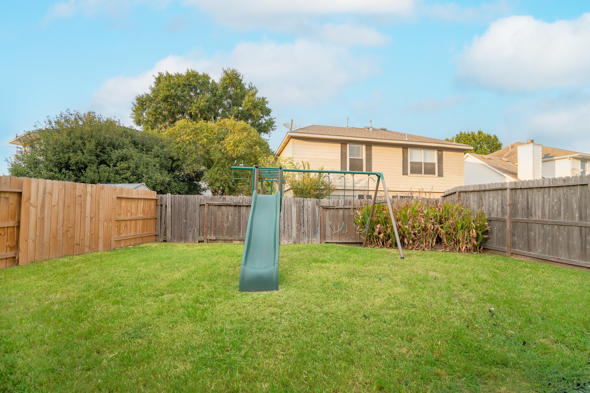2322 Hadden Hollow Drive Houston, TX 77067 - Photo 26 of 28 a front view of a house with a yard and fence
