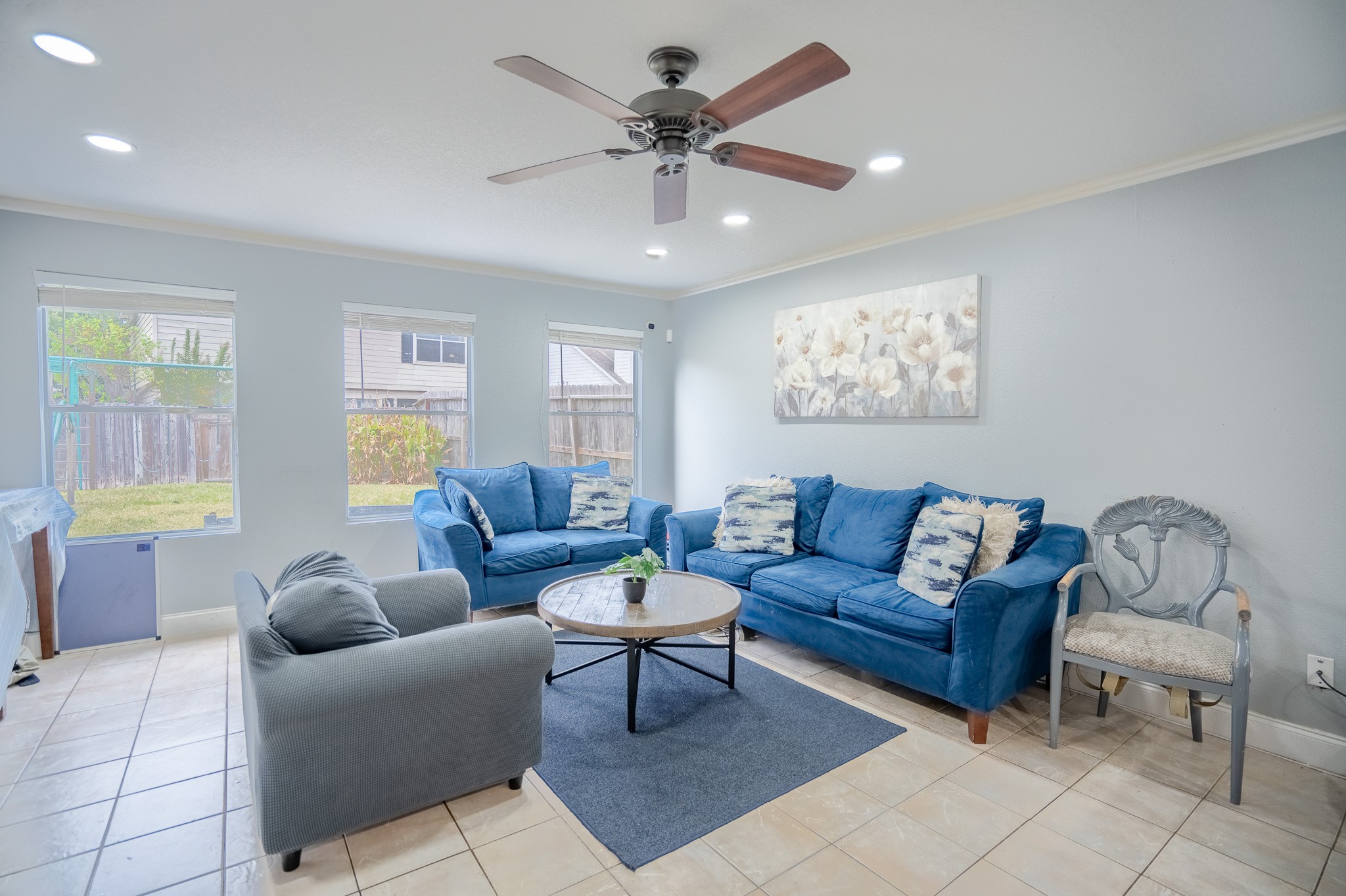 2322 Hadden Hollow Drive Houston, TX 77067 - Photo 3 of 28 a living room with furniture a chandelier and a window