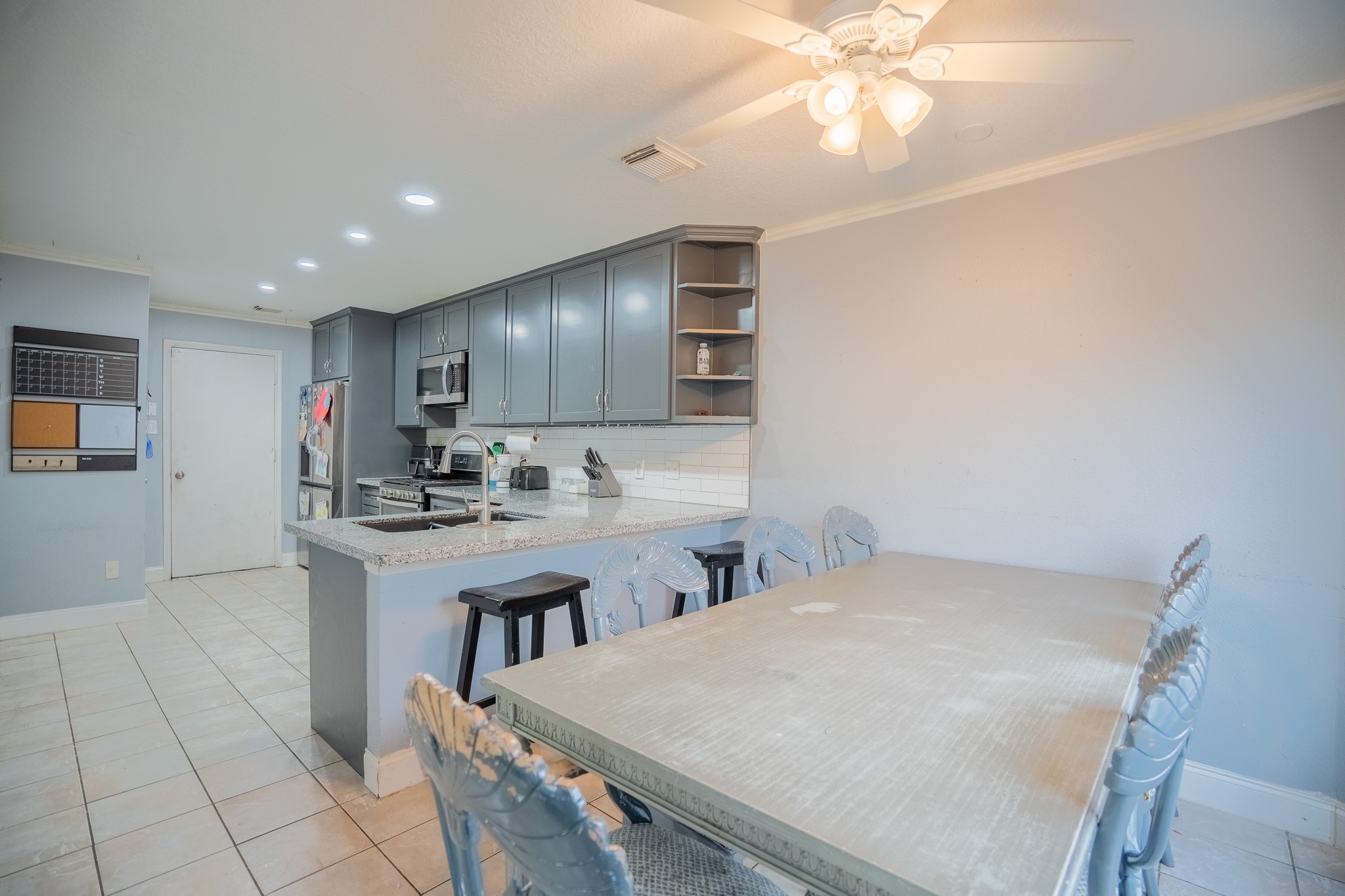 2322 Hadden Hollow Drive Houston, TX 77067 - Photo 10 of 28 a kitchen with cabinets and window