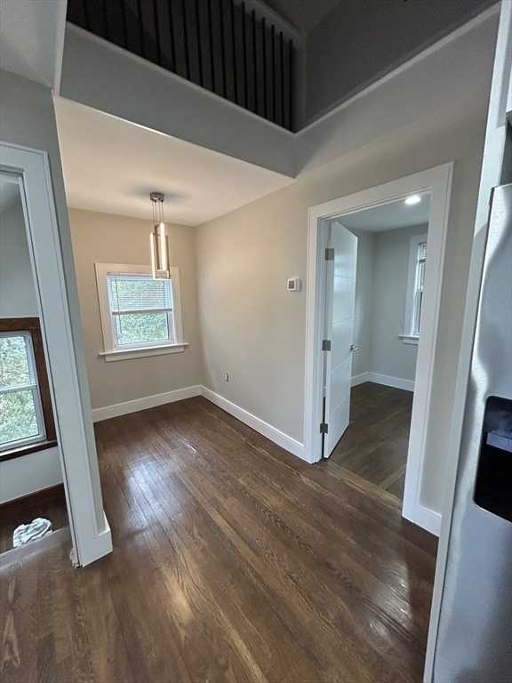 9 Hawthorne Road, Unit 2 Gloucester, MA 01930 - Photo 4 of 9 wooden floor in an empty room with a window